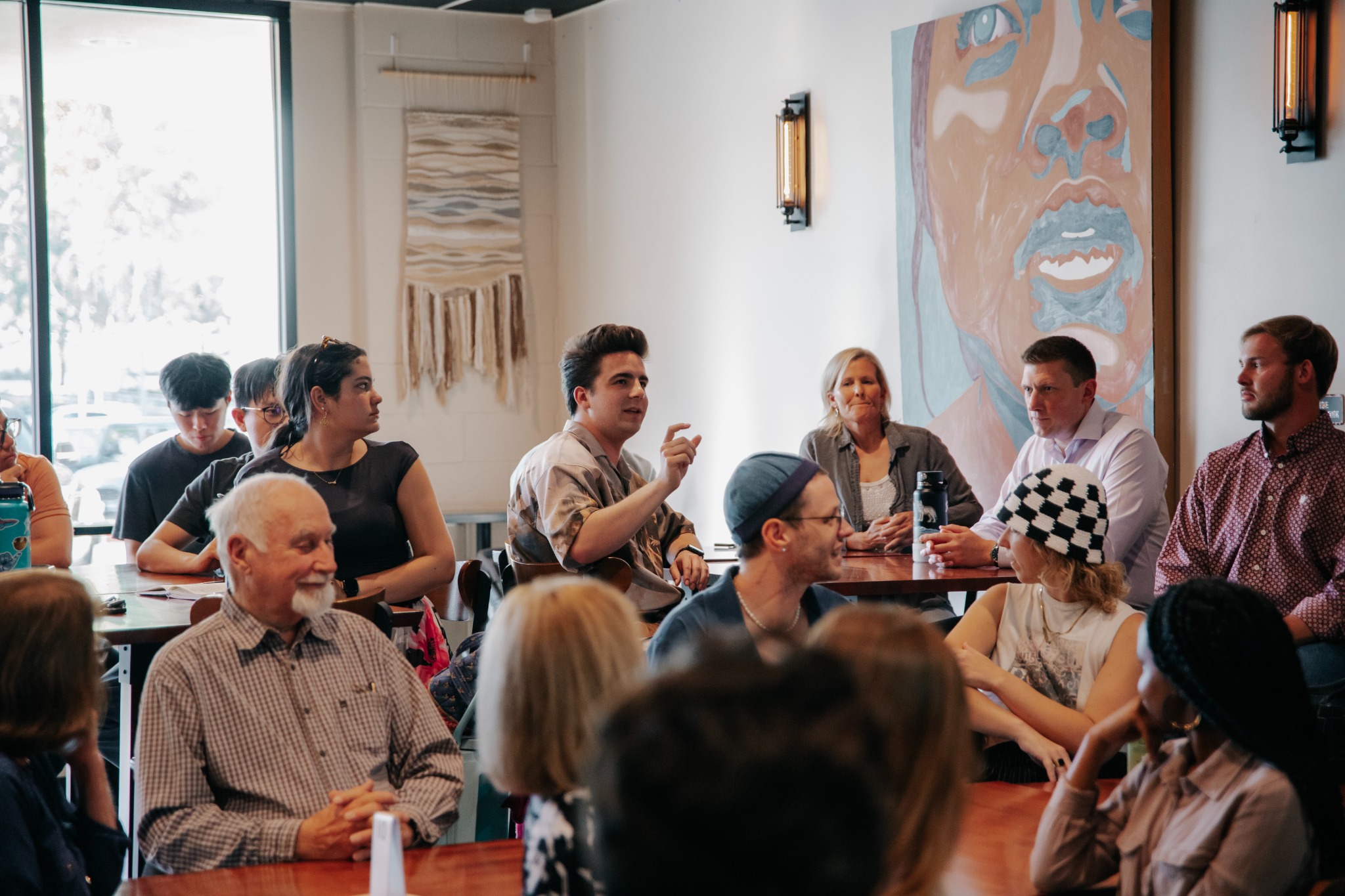 The Agora LA community participating in a public roundtable discussion