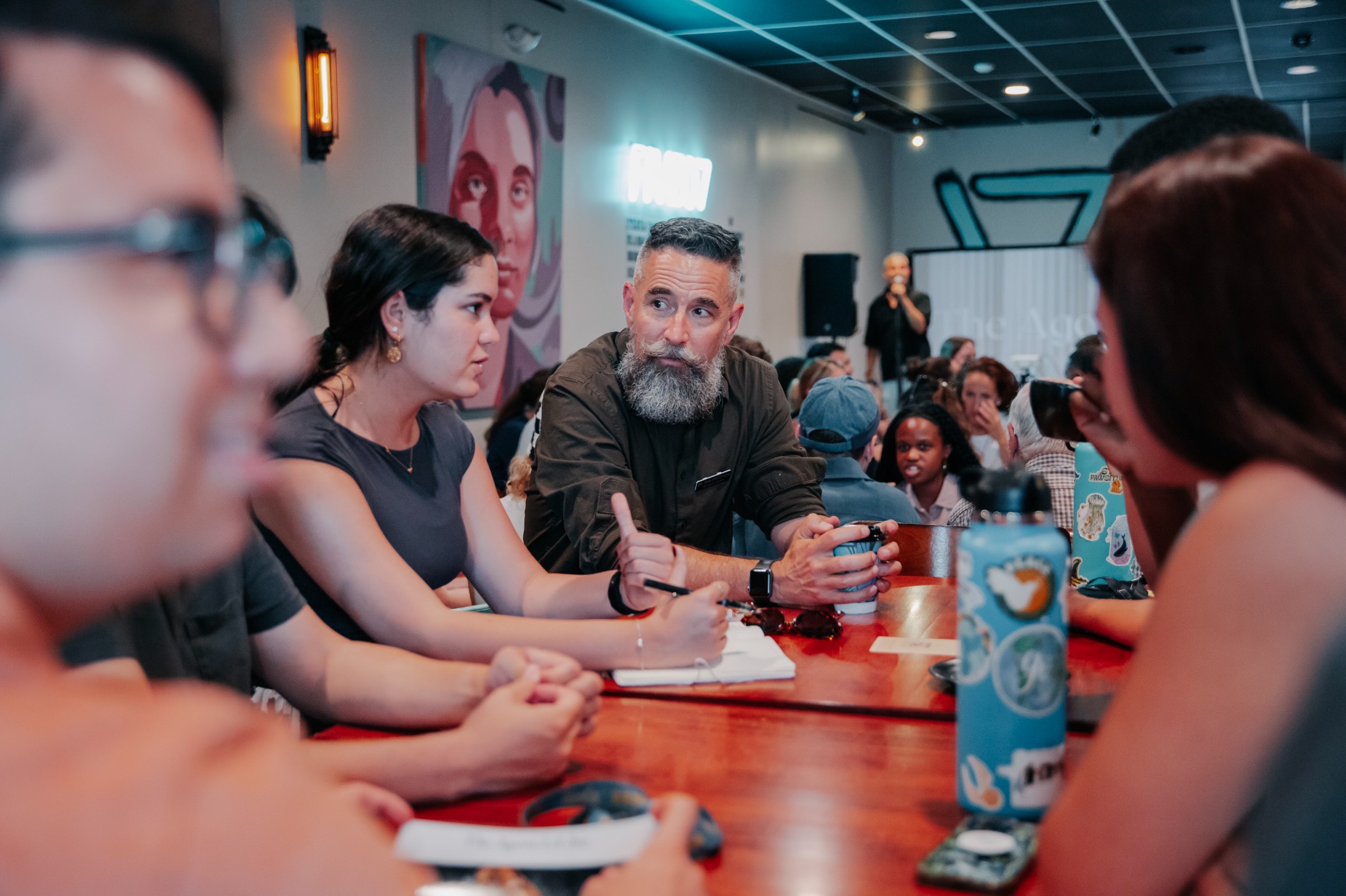 Agora attendees engaged in a roundtable discussion