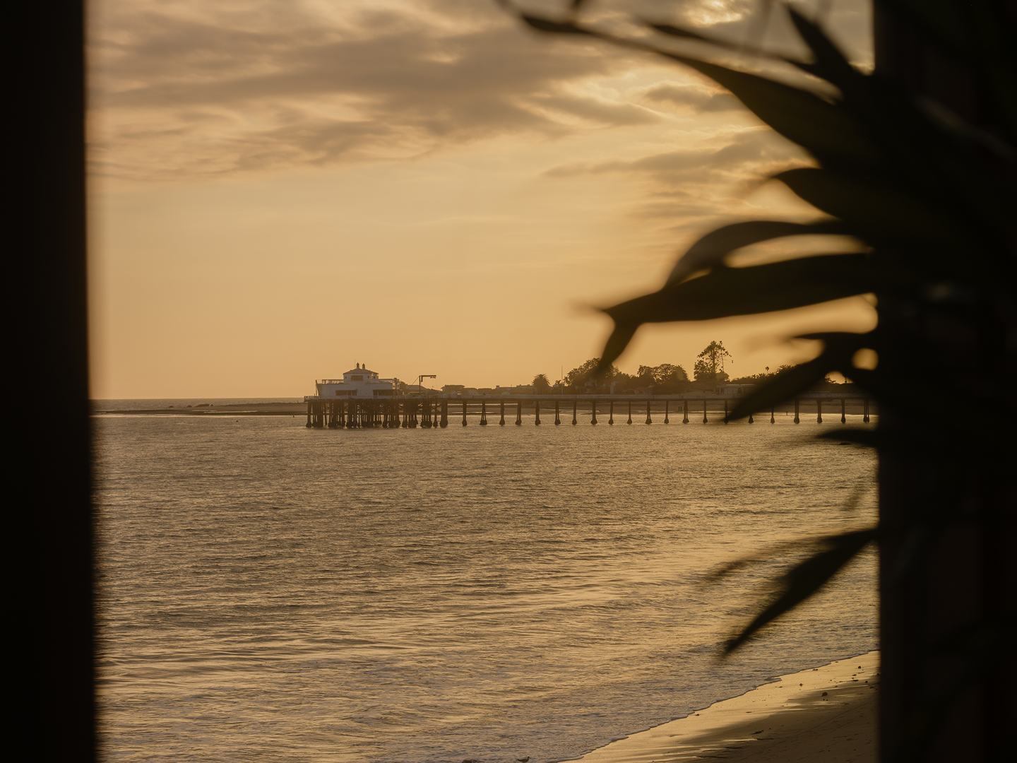 Pacific Ocean and Malibu Pier seen from Little Beach House Malibu at sunset