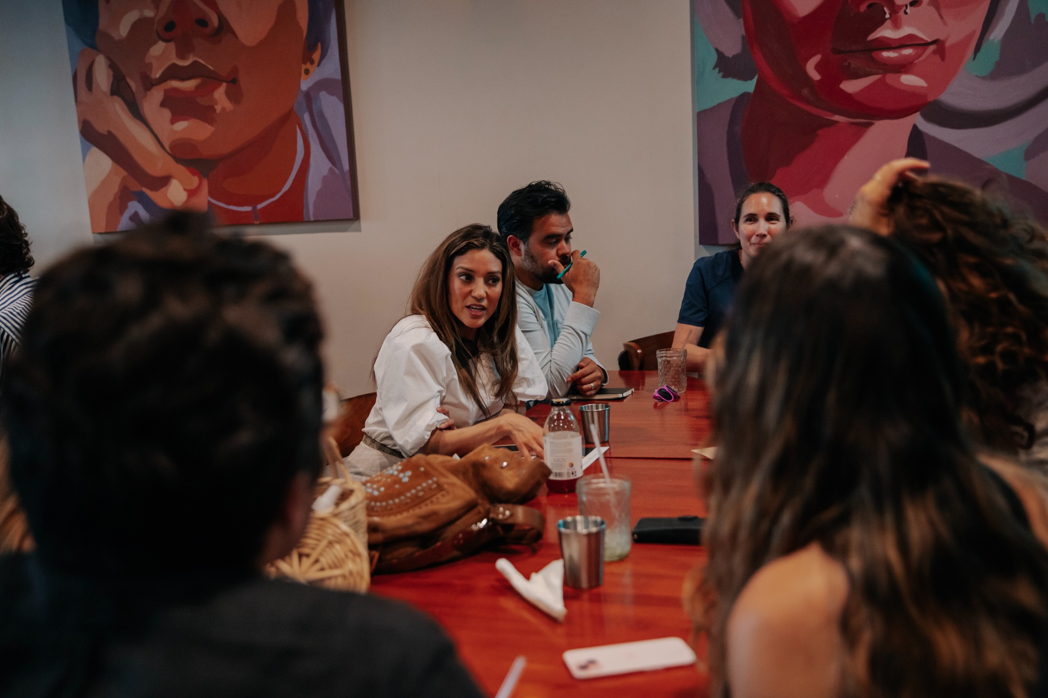 Agora participants examining ideas at a roundtable